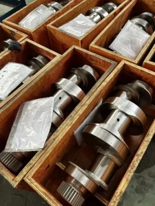 CNC crank pin and journal grinding machine image showing dedicated machine-tool context for automotive crankshaft pin grinding.