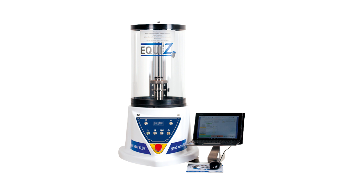 Grinding wheel balancing setup highlighting wheel mounting and balance-control hardware in industrial service context