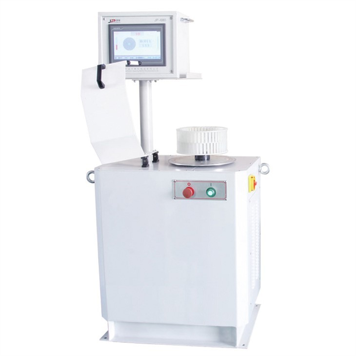 Grinding wheel dynamic balancing machine used to correct wheel assembly imbalance before production grinding