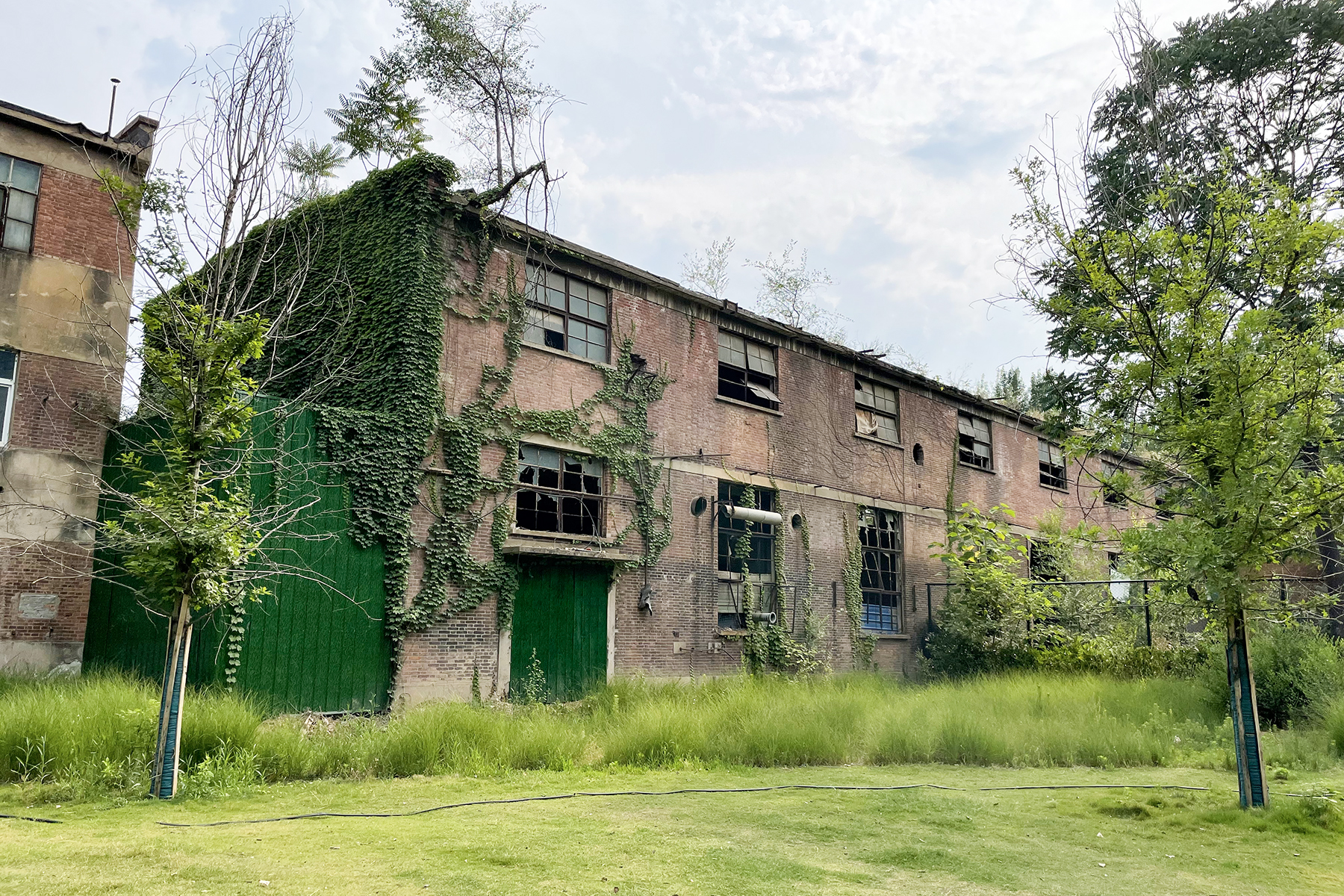 Industrial grinding wheel manufacturing workshop showing multiple wheel forms and production context, suitable for illustrating how different wheel types relate to specification codes.
